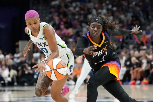 Minnesota Lynx guard Courtney Williams, left, battles with Phoenix Mercury guard Kahleah Copper for a loose ball during the first half of Game 3 of a WNBA basketball playoff semifinals series game Friday, Sept. 26, 2025, in Phoenix. (AP Photo/Ross D. Franklin) Minnesota Lynx guard Courtney Williams, left, battles with Phoenix Mercury guard Kahleah Copper for a loose ball during the first half of Game 3 of a WNBA basketball playoff semifinals series game Friday, Sept. 26, 2025, in Phoenix. (AP Photo/Ross D. Franklin)
