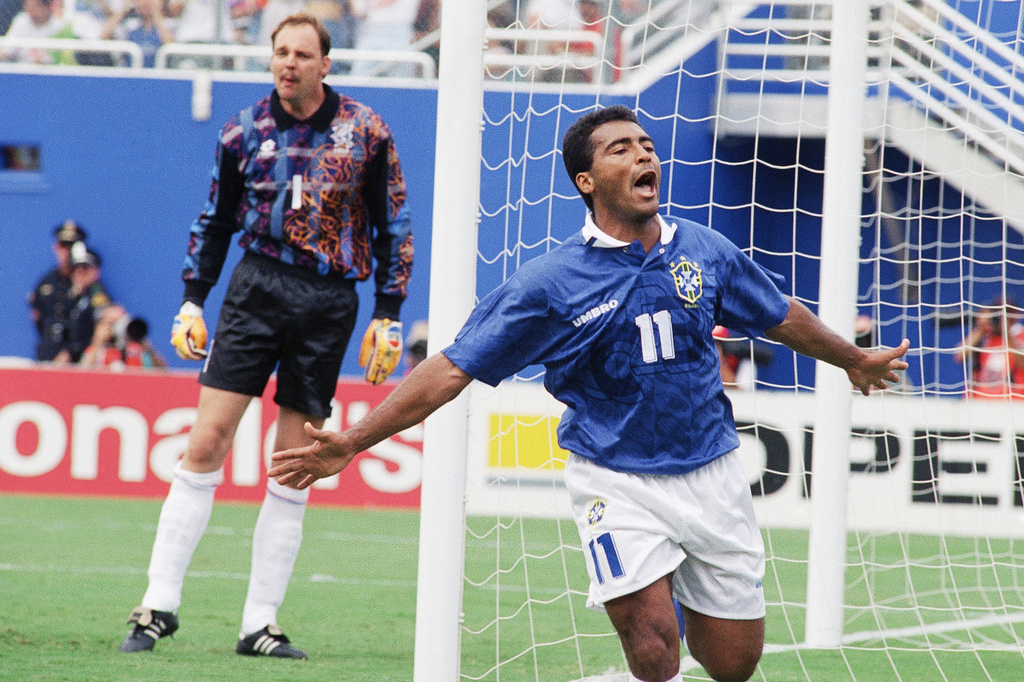 FILE - Brazil's Romario (11) celebrates after scoring Brazil's first goal as Netherlands' goalkeeper Ed De Goej looks on during the second half of a World Cup quarterfinal soccer match at the Cotton Bowl in Dallas, Texas, Saturday, July 9, 1994. (AP Photo/Michael Probst, File)
