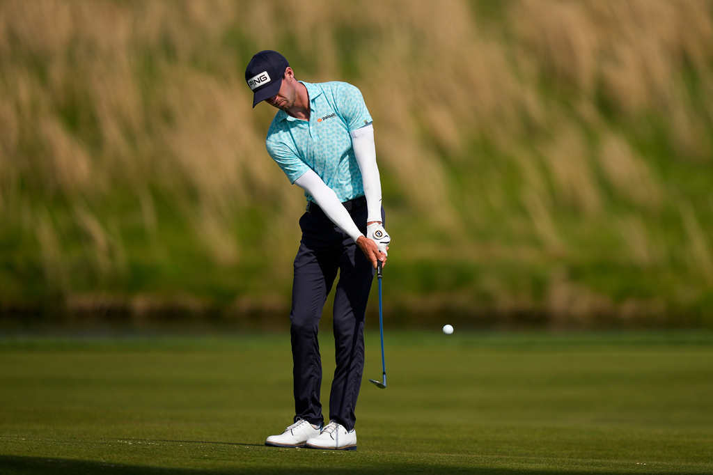 Alex Smalley hits on the eighth hole during the third round of the PGA Championship golf tournament at Aronimink Golf Club, Saturday, May 16, 2026, in Newtown Square, PA. (AP Photo/Matt Slocum)