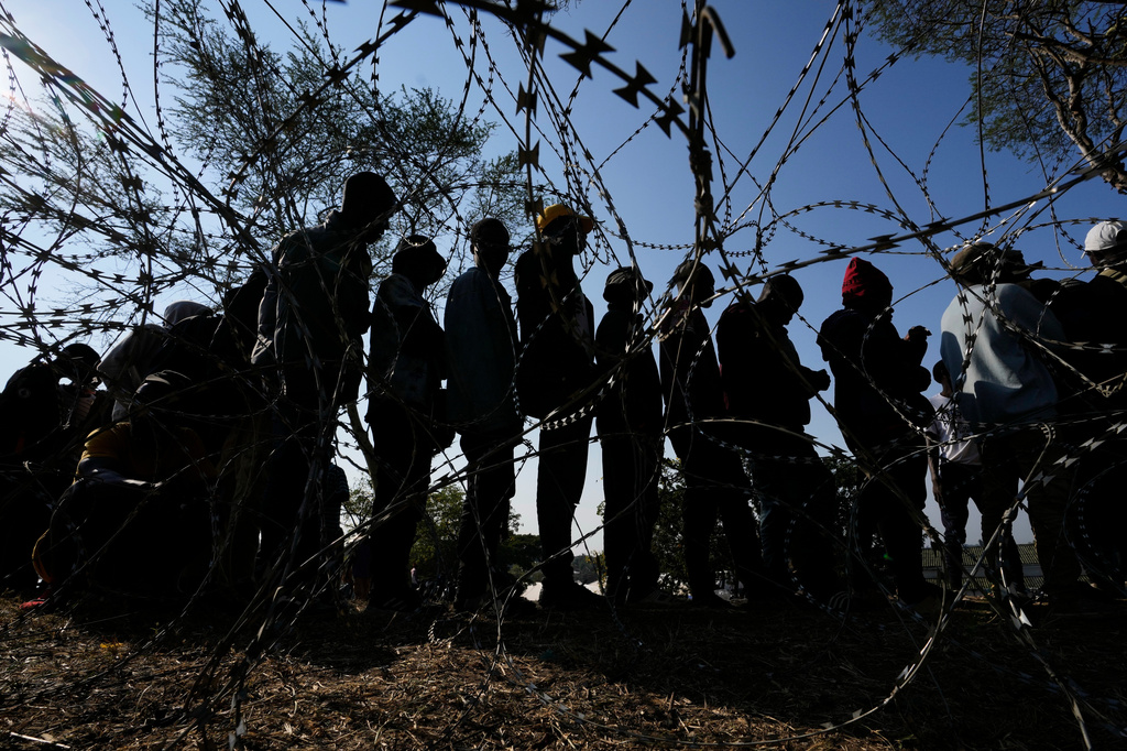 FILE - Malawian migrants stand in a queue for their deportation at a temporary centre, in Durban, South Africa, on June 18, 2026. (AP Photo/Themba Hadebe, file)