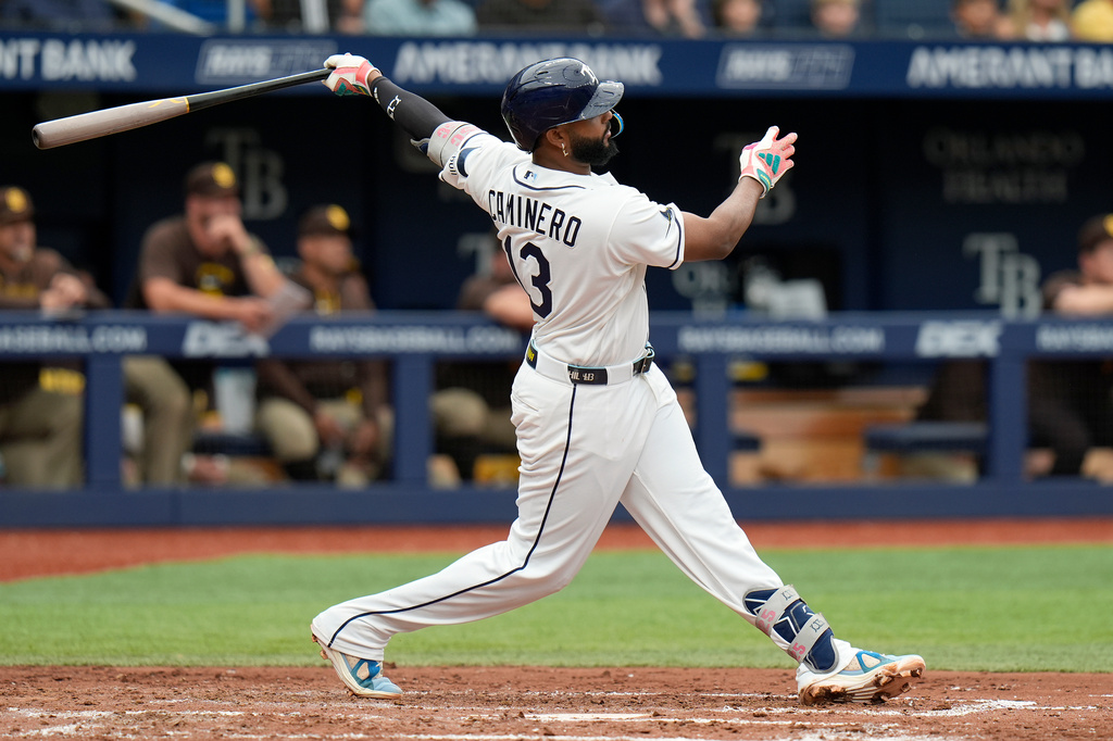 Tampa Bay Rays' Junior Caminero watches his home run off San Diego Padres pitcher Robbie Ray during the fourth inning of a baseball game Sunday, Aug. 30, 2026, in St. Petersburg, Fla. (AP Photo/Chris O'Meara)