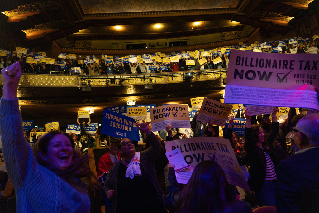 People cheer during a performance by Tom Morello at a campaign event for a proposed "billionaires tax," in Los Angeles, Wednesday, Feb. 18, 2026. (AP Photo/Jae C. Hong)