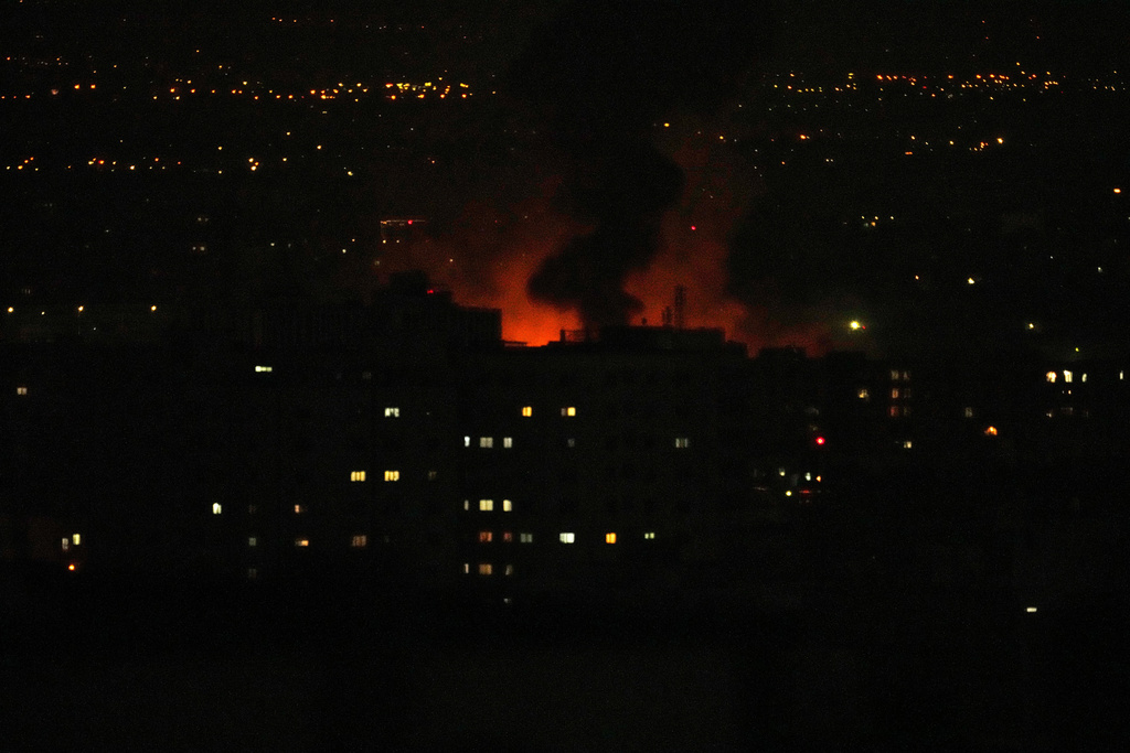 Smoke rise as strikes hit the city during the U.S.–Israeli military campaign, in Tehran, Iran, Saturday, March 7, 2026. (AP Photo/Vahid Salemi)