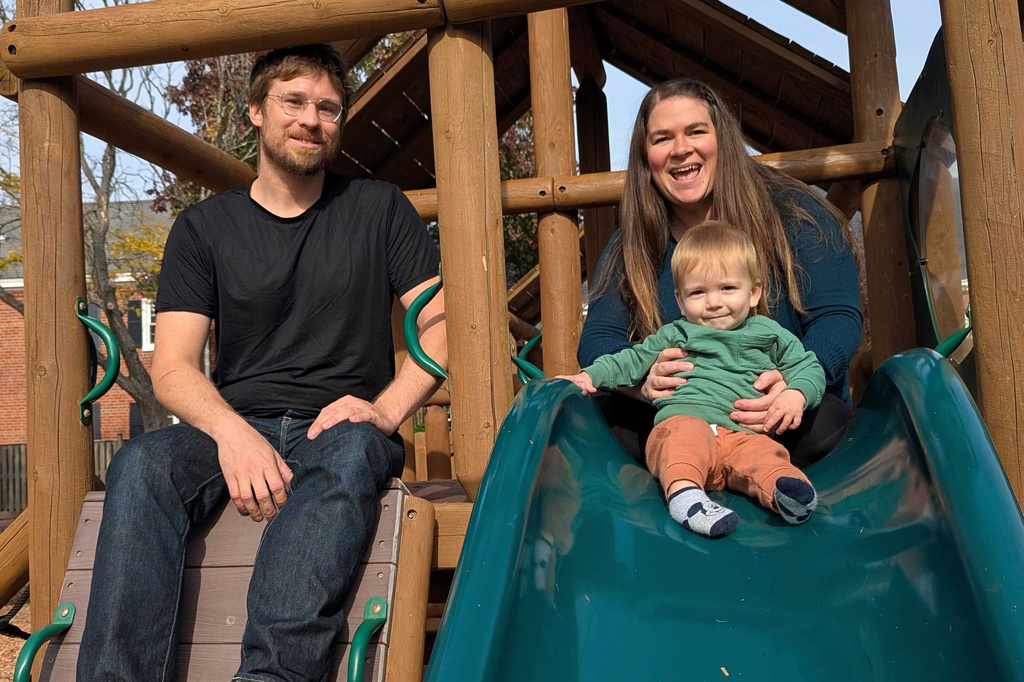 FILE - Thea Price, top right, whose family is moving away from the Washington region and back to her hometown of Seattle after losing their jobs and relying on savings and food assistance programs like SNAP, poses for a photo on a playground with her husband Nikita and 10-month old boy Nikolai, in Arlington, Va., Nov. 7, 2025. (AP Photo/Nathan Ellgren, file)