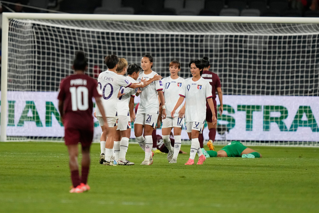 Taiwan's Chen Yu-chin (21) celebrates with teammates after scoring her side's third goal during the Women's Asian Cup soccer match between India and Taiwan in Sydney, Tuesday, March 10, 2026. (AP Photo/Rick Rycroft)