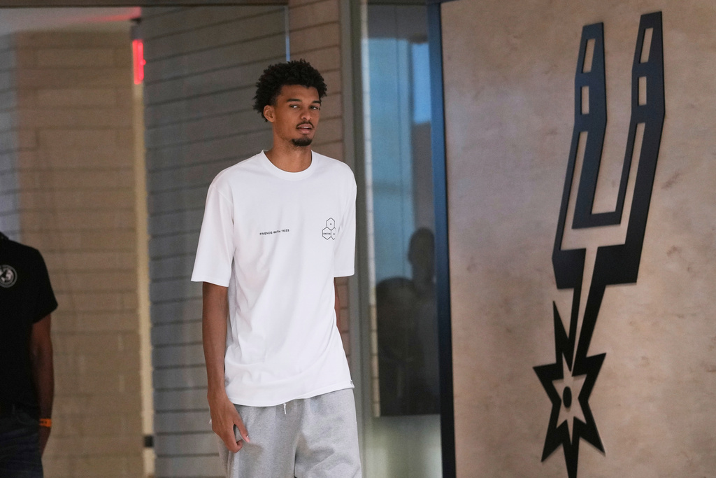 FILE - Spurs' Victor Wembanyama arrives for a news conference in San Antonio, May 5, 2025. (AP Photo/Eric Gay, File)