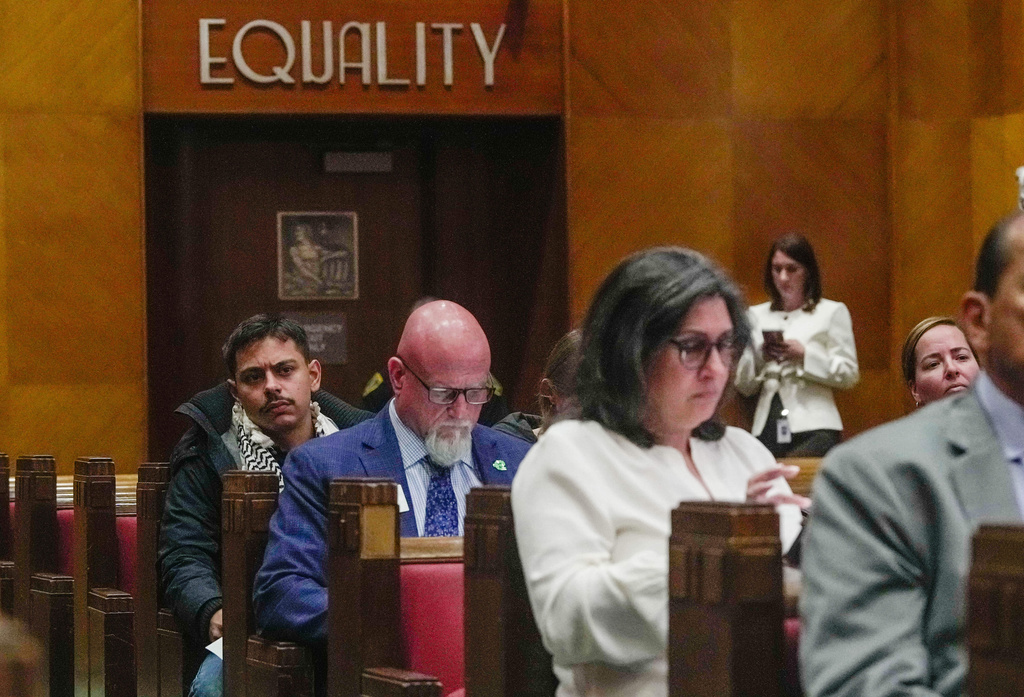 Members of the public listen during a City Council meeting considering whether to repeal a newly approved proposal limiting cooperation with U.S. Immigration and Customs Enforcement at City Hall, in Houston, Wednesday, April 22, 2026. (Raquel Natalicchio/Houston Chronicle via AP)