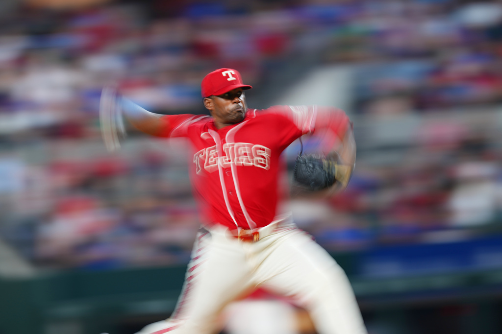 Texas Rangers starting pitcher Kumar Rocker throws to the Chicago Cubs during the fourth inning of a baseball game Friday, May 8, 2026, in Arlington, Texas. (AP Photo/Julio Cortez)