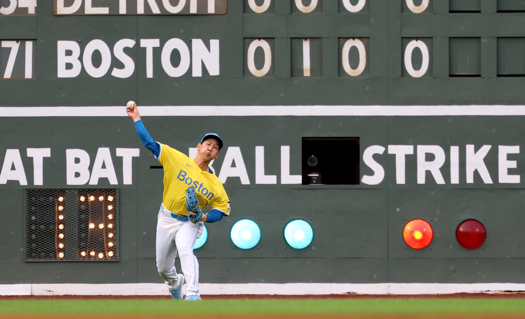 Boston Red Sox outfielder Masataka Yoshida throws on a single by Detroit Tigers' Dillon Dingler during the fifth inning of a baseball game, Saturday, Sept. 27, 2025, in Boston. (AP Photo/Mark Stockwell)