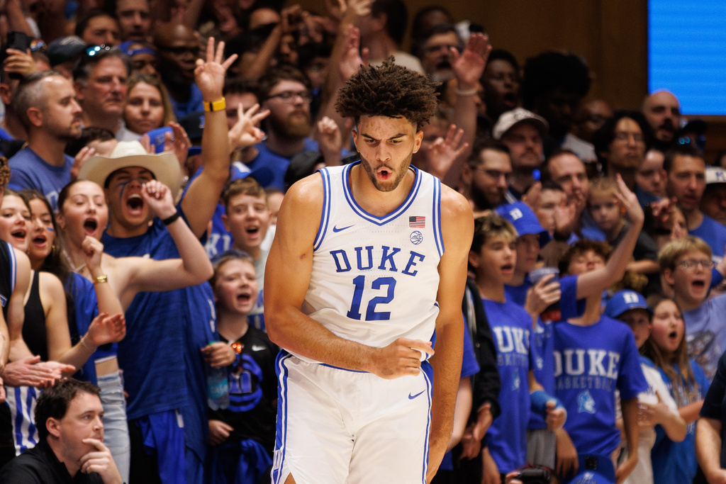 Duke's Cameron Boozer (12) reacts after hitting a 3-pointer during the first half of an NCAA college basketball game against Western Carolina in Durham, N.C., Saturday, Nov. 8, 2025. (AP Photo/Ben McKeown)