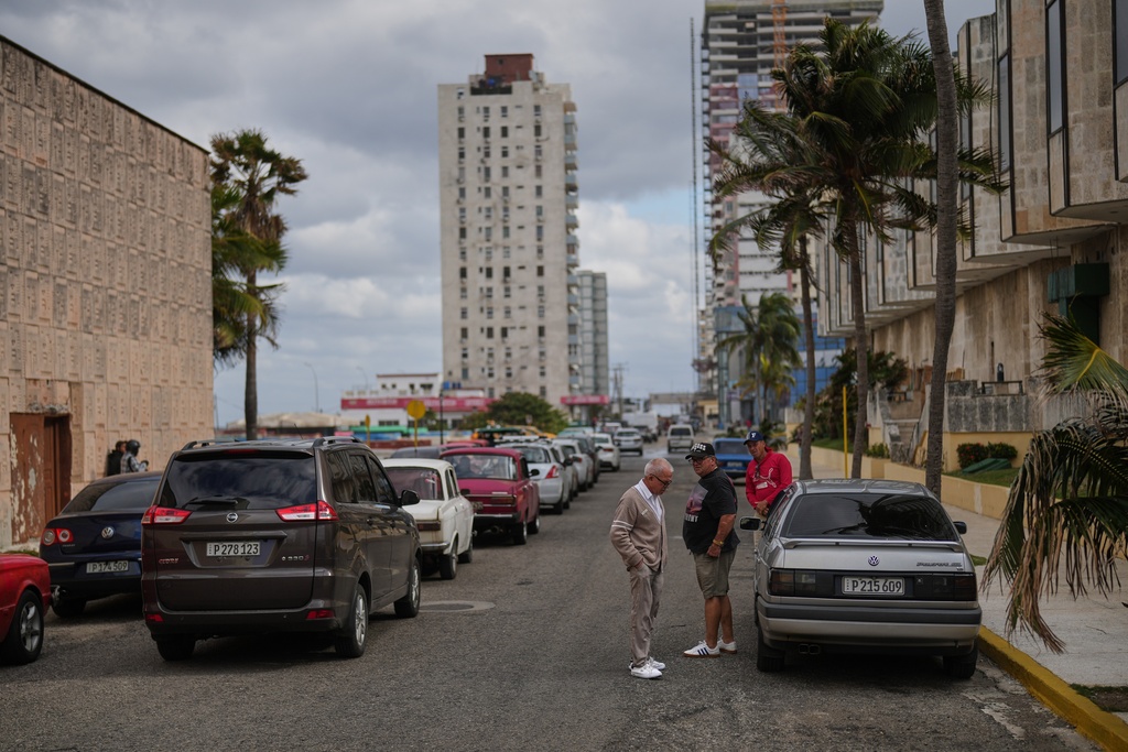 Drivers wait in line to fill up at a gas station in Havana, Cuba, Tuesday, Jan. 27, 2026. (AP Photo/Ramon Espinosa)