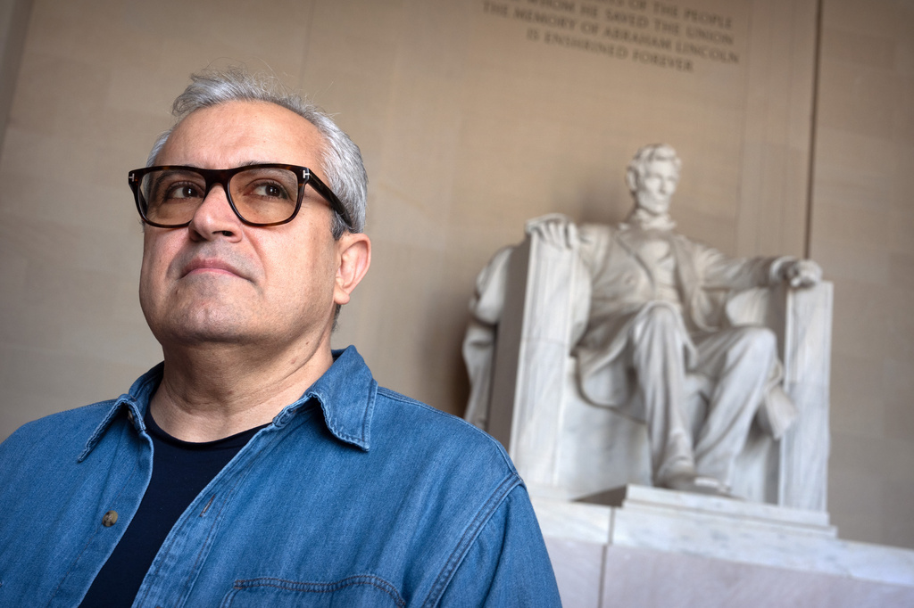 Iranian expatriate Nik Kowsar poses for a photograph at the Lincoln Memorial, March 31, 2026, in Washington. (AP Photo/Mark Schiefelbein)