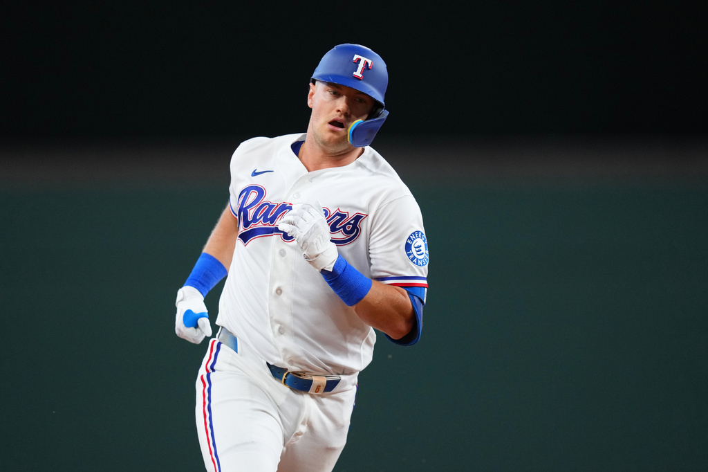 Texas Rangers' Josh Jung runs the bases after hitting a solo home run against the Chicago Cubs during the second inning of a baseball game Saturday, May 9, 2026, in Arlington, Texas. (AP Photo/Julio Cortez)