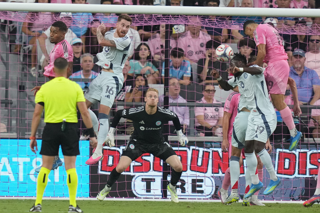 Chicago Fire forward Jonathan Bamba (19) heads the ball as goalkeeper Chris Brady (1) defends the goal during the first half of an MLS soccer match against Inter Miami, Wednesday, July 22, 2026, in Miami. (AP Photo/Lynne Sladky)