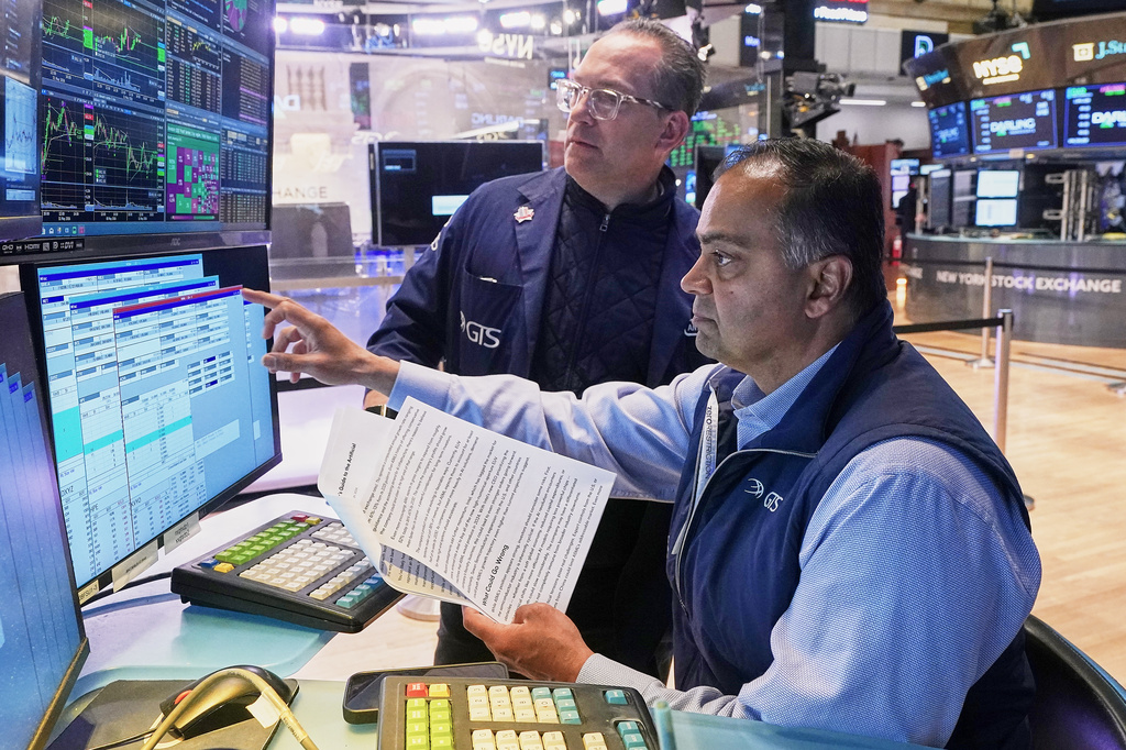 Specialists Anthony Matesic, left, and Dilip Patel work on the floor of the New York Stock Exchange, Monday, May 11, 2026. (AP Photo/Richard Drew)