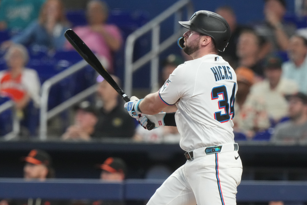 Miami Marlins' Liam Hicks (34) hits a two-run home run during the first inning of a baseball game against the Baltimore Orioles Thursday, May 7, 2026, in Miami. (AP Photo/Marta Lavandier)