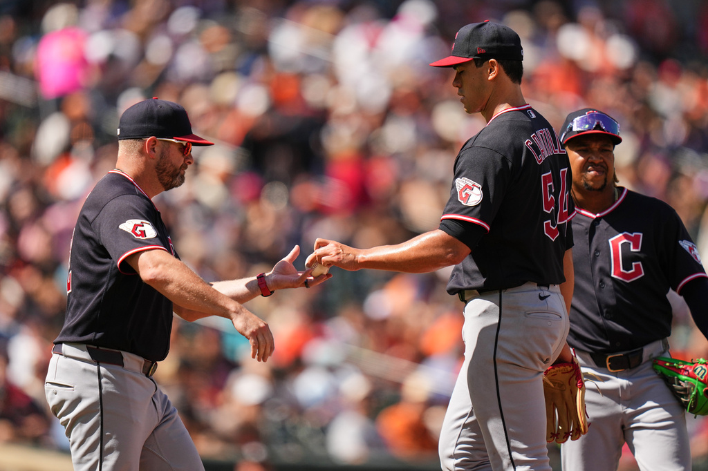 Cleveland Guardians starting pitcher Joey Cantillo (54) hands the ball to manager Stephen Vogt, left, while leaving the mound during a pitching substitution in the third inning of a baseball game against the Baltimore Orioles, Monday, Sept. 7, 2026, in Baltimore. (AP Photo/Stephanie Scarbrough)