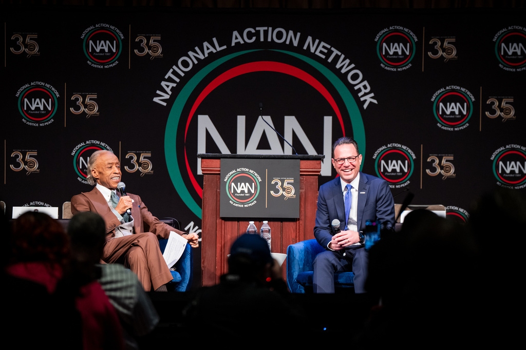 Josh Shapiro, Governor of Pennsylvania, speaks with Reverend Al Sharpton during the National Action Network (NAN) Convention in New York, Wednesday, April 8, 2026. (AP Photo/Angelina Katsanis)