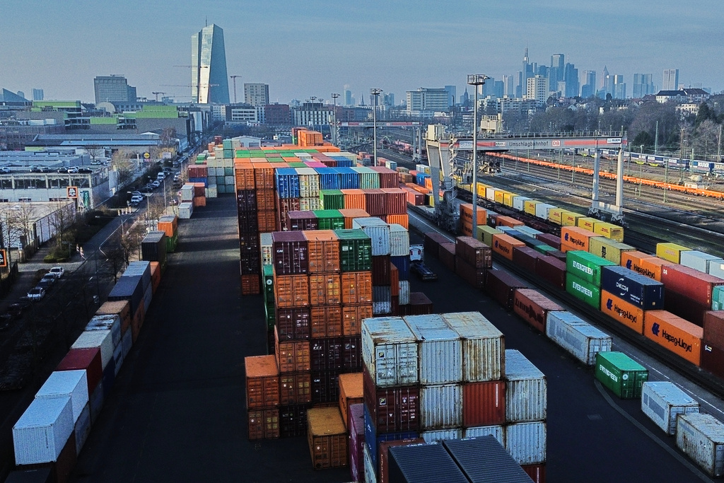 Containers are piled up at a cargo terminal in Frankfurt, Germany, Friday, Jan. 23, 2026. (AP Photo/Michael Probst)
