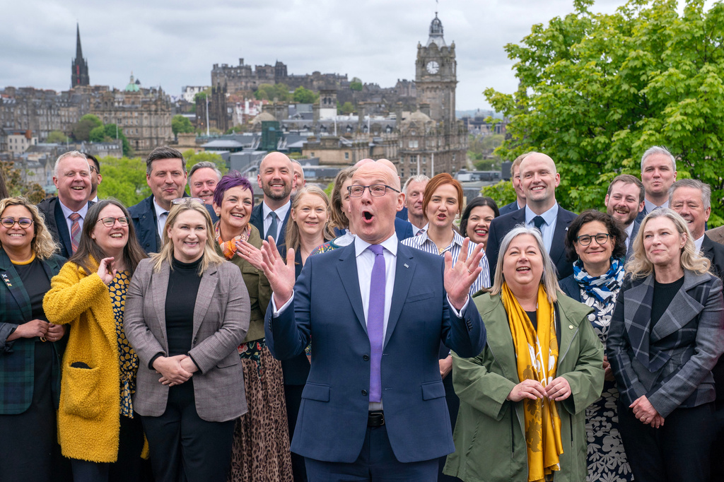 First Minister and SNP leader John Swinney with some of the newly elected SNP MSPs in Edinburgh, Saturday May 9, 2026, following the 2026 Holyrood elections. (Jane Barlow/PA via AP)