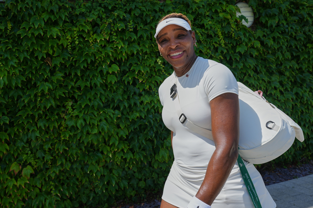 Serena Williams of the United States smiles after a training session at the All England Lawn Tennis and Croquet Club, ahead of the Wimbledon Championships in London, Thursday, June 25, 2026. (AP Photo/Kirsty Wigglesworth)