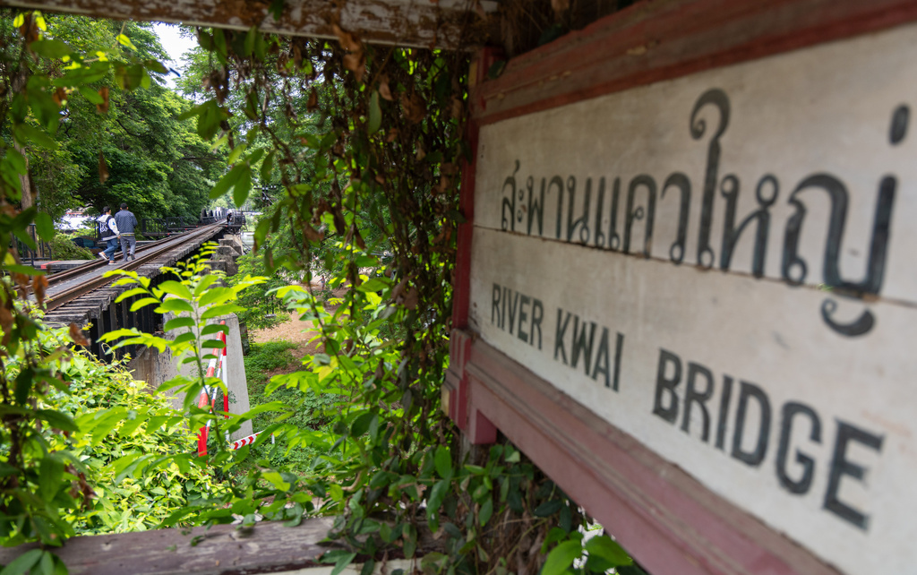 Visitors walk along the River Kwai Bridge, one of the well-known sections of the infamous World War II "Death Railway," in Kanchanaburi, Thailand on Thursday, May 28, 2026. (AP Photo/Anton L. Delgado)
