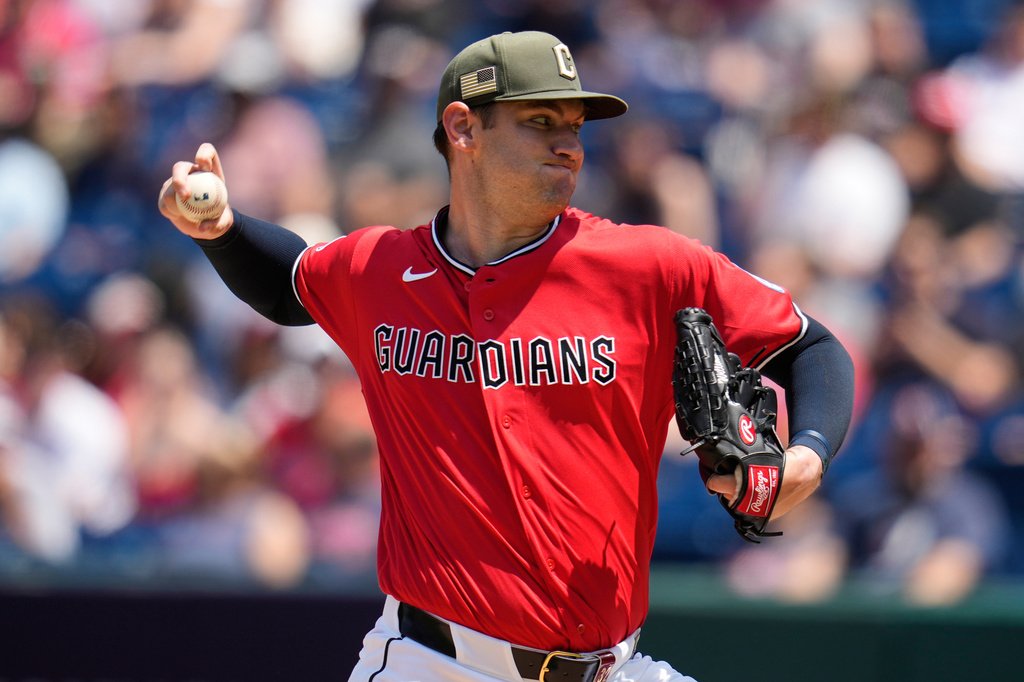 Cleveland Guardians' Gavin Williams pitches in the first inning of a baseball game against the Cincinnati Reds in Cleveland, Sunday, May 17, 2026. (AP Photo/Sue Ogrocki)