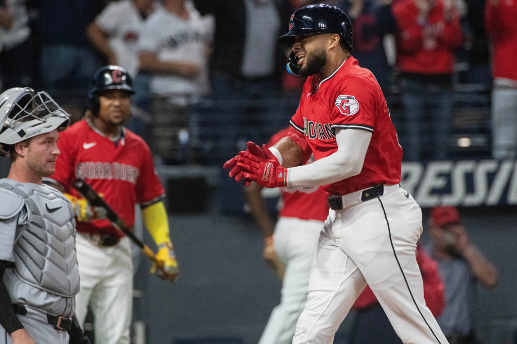 Cleveland Guardians' George Valera reacts after hitting a two-run home run off Detroit Tigers starting pitcher Jack Flaherty as Tigers catcher Dillon Dingler looks on during the third inning of a baseball game, Wednesday, Sept. 24, 2025, in Cleveland. (AP Photo/Phil Long)