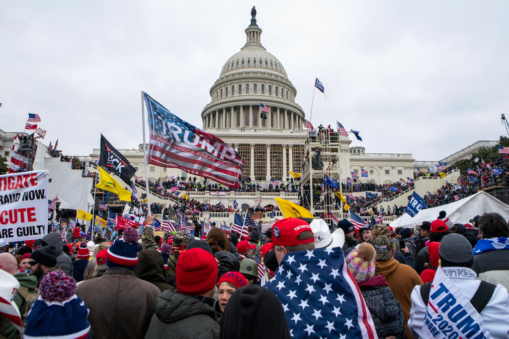 FILE - Rioters loyal to President Donald Trump rally at the U.S. Capitol in Washington on Jan. 6, 2021. (AP Photo/Jose Luis Magana, File)