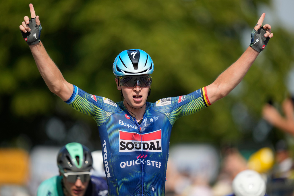Belgium's Tim Merlier celebrates as he crosses the finish line to win the eighth stage of the Tour de France cycling race with start in Perigueux and finish in Bergerac, France, Saturday, July 11, 2026. (AP Photo/Mosa'ab Elshamy)