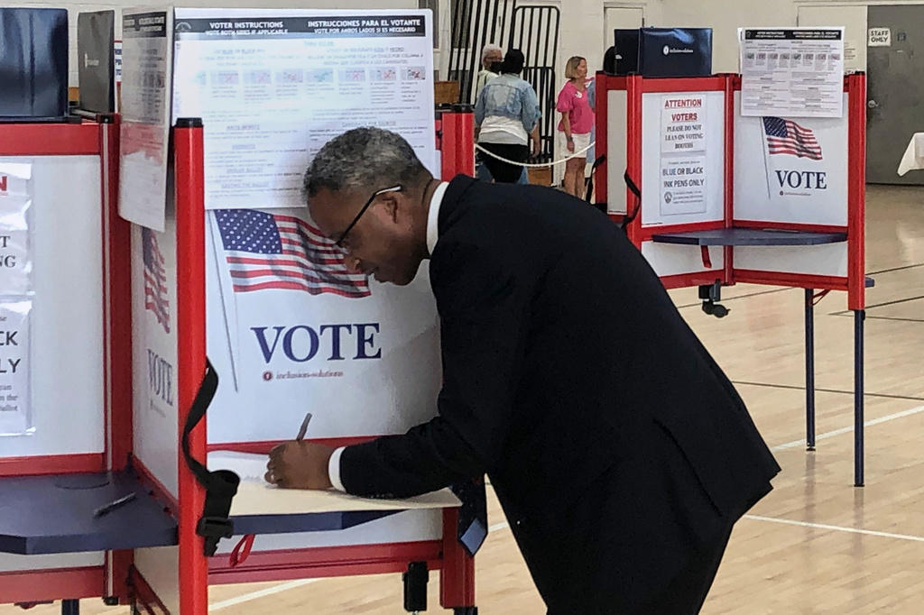 District of Columbia mayoral candidate Kenyan McDuffie fills out his ranked choice ballot during the D.C. primary election, Tuesday, June 16, 2026 in Washington. (AP Photo/Gary Fields)