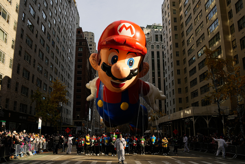 The Mario balloon floats down Sixth Avenue during the Macy's Thanksgiving Day Parade, Thursday, Nov. 27, 2025, in New York. (AP Photo/Eduardo Munoz Alvarez)