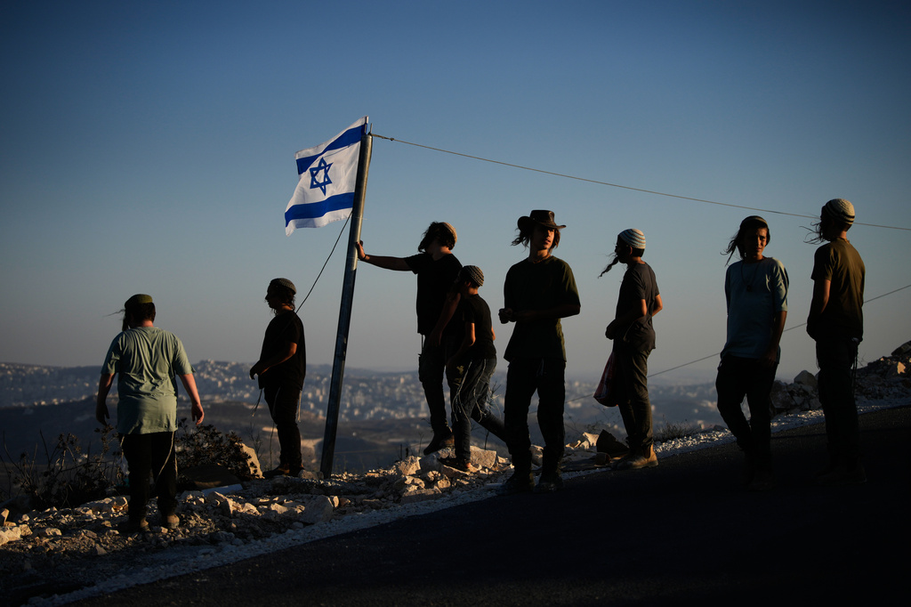Israeli settlers gather to celebrate the inauguration of a newly built synagogue at the occupied West Bank outpost of Homesh, Wednesday, Sept. 16, 2026. (AP Photo/Ohad Zwigenberg)