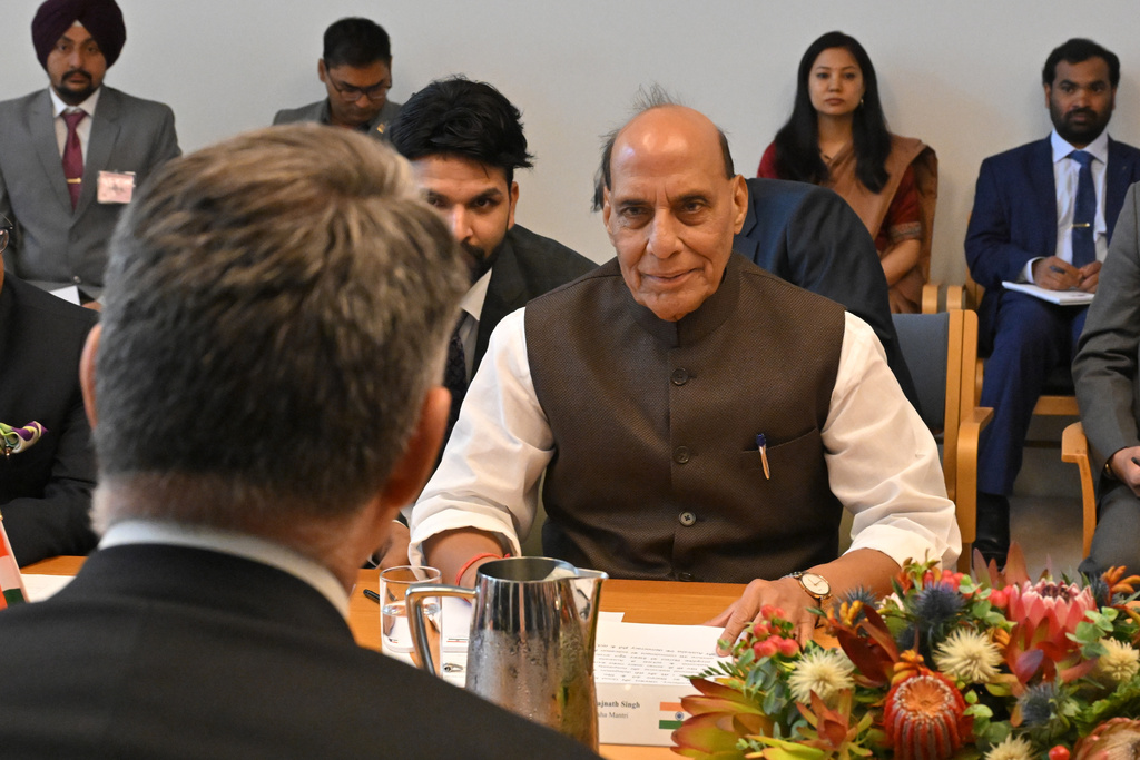 India's Defence Minister Rajnath Singh, right, sits with his Australian counterpart Richard Marles, back to camera, at Parliament House in Canberra, Australia, Thursday, Oct. 9, 2025. (Mick Tsikas/AAP Image via AP)