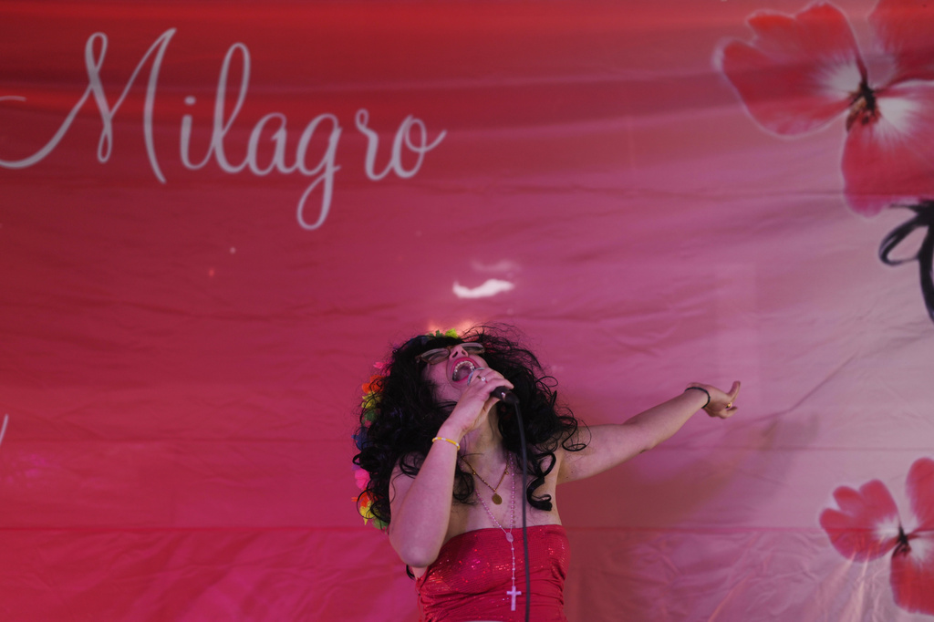 A woman sings at a sanctuary dedicated to late Argentine singer Gilda on the 30th anniversary of her death in a bus crash, in Entre Rios, Argentina, Monday, Sept. 7, 2026. (AP Photo/Natacha Pisarenko)