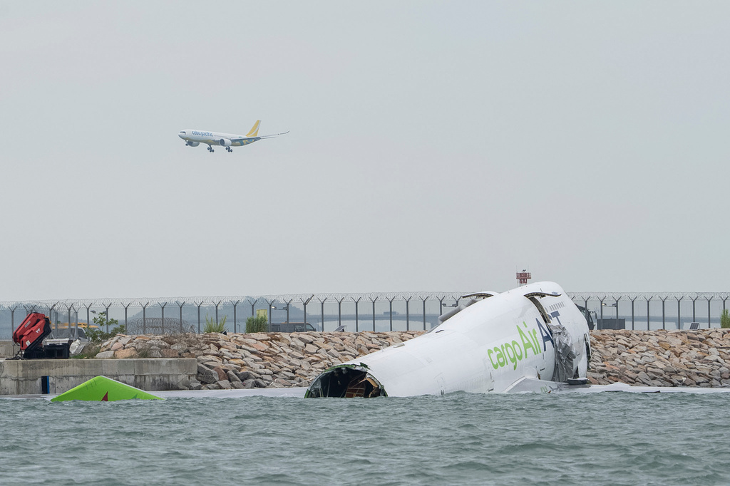 A view of the cargo aircraft that skidded off a Hong Kong runway on Monday, Oct. 20, 2025. (AP Photo/Chan Long Hei)