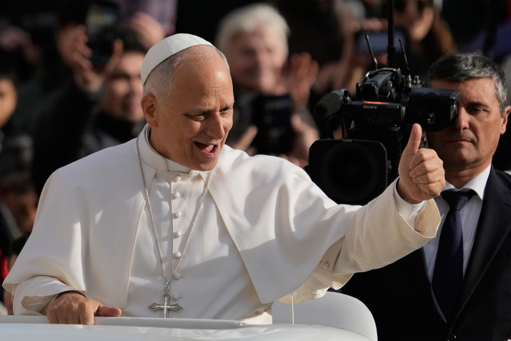 Pope Leo XIV greets faithful as he arrives in St. Peter's Square on the occasion of the last Jubilee audience, at the Vatican, Saturday, Dec. 20, 2025. (AP Photo/Gregorio Borgia)