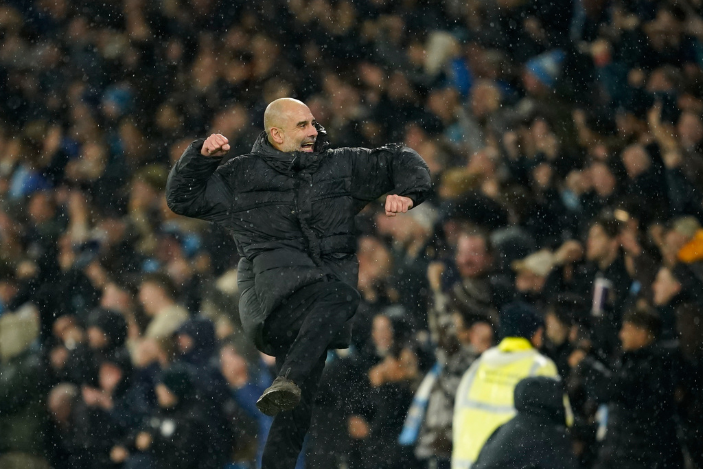 Manchester City's head coach Pep Guardiola celebrates after Manchester City's Erling Haaland scoring his side's third goal during the English Premier League soccer match between Manchester City and Fulham in Manchester, England, Wednesday, Feb. 11, 2026. (AP Photo/Dave Thompson)