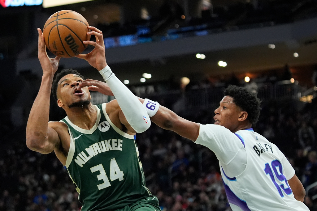 Milwaukee Bucks' Giannis Antetokounmpo (34) drives to the basket against Utah Jazz's Ace Bailey during the second half of an NBA basketball game Saturday, March 7, 2026, in Milwaukee. (AP Photo/Aaron Gash)