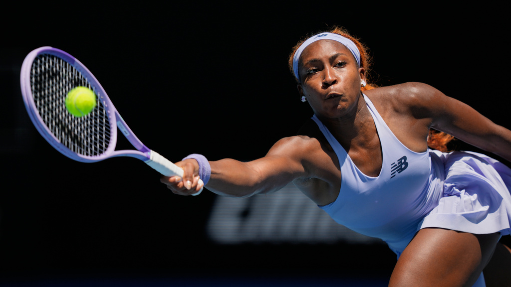 Coco Gauff of the U.S. plays a forehand return to Kamilla Rakhimova of Uzbekistan during their first round match at the Australian Open tennis championship in Melbourne, Australia, Monday, Jan. 19, 2026. (AP Photo/Aaron Favila)