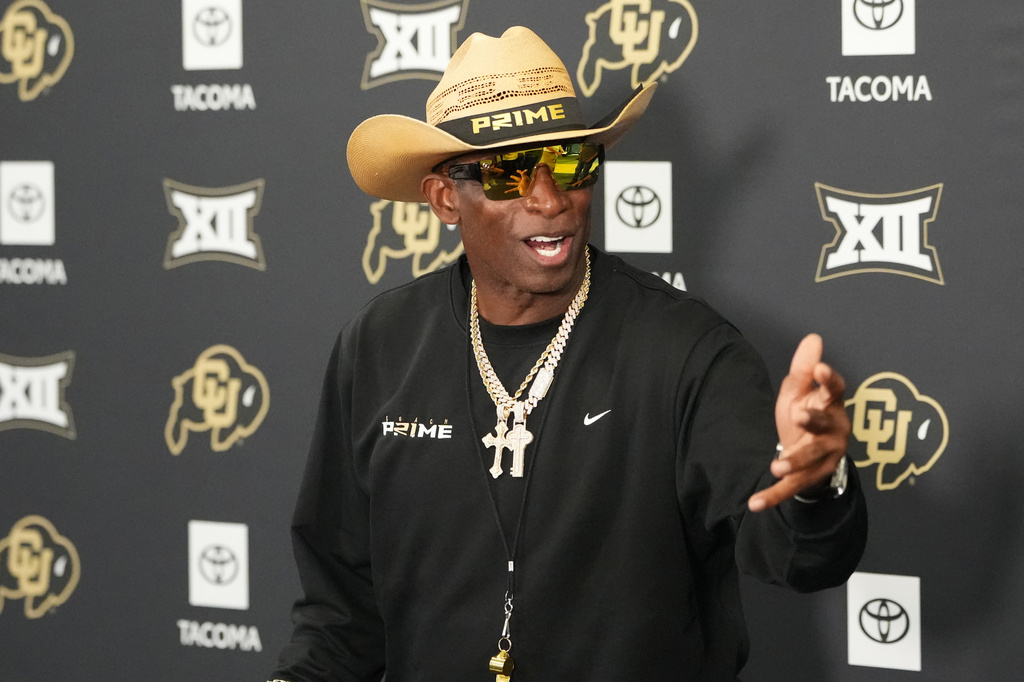 Colorado head coach Deion Sanders talks to reporters after practice at an NCAA college football training camp in Fountain, Colo., Thursday, Aug. 6, 2026. (AP Photo/David Zalubowski)