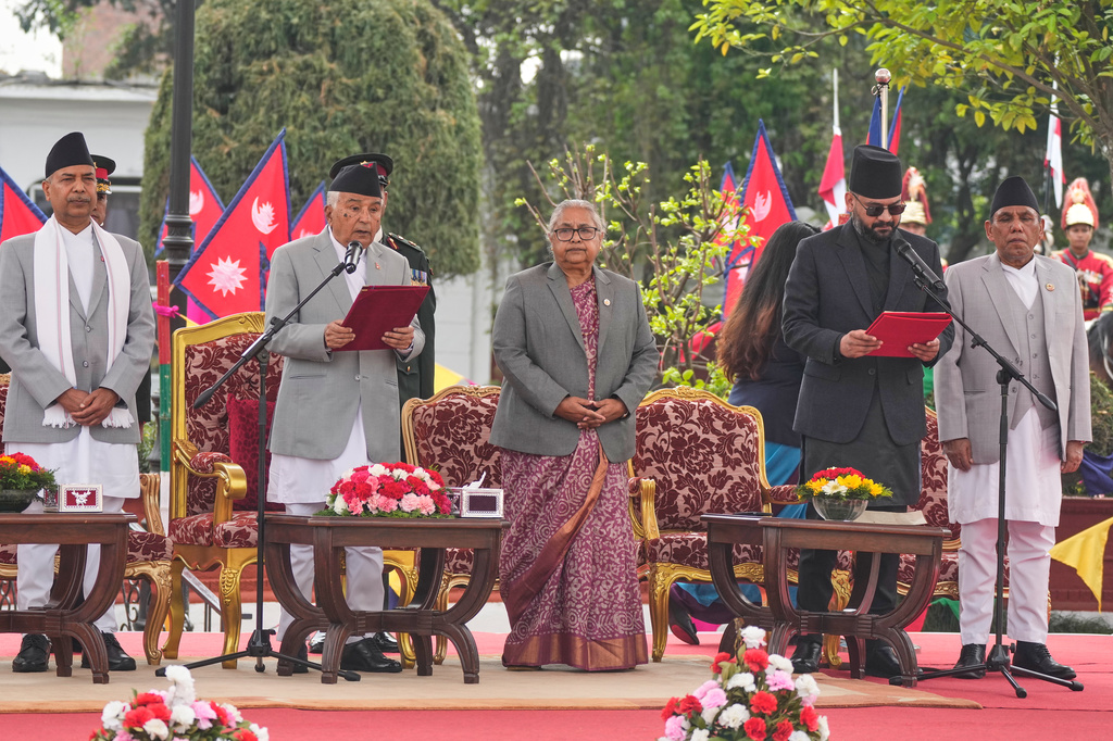 Nepal's youngest Prime Minister Balendra Shah, second right, takes the oath of office at a function in Kathmandu, Nepal, Friday, March 27, 2026. (AP Photo/Niranjan Shrestha)