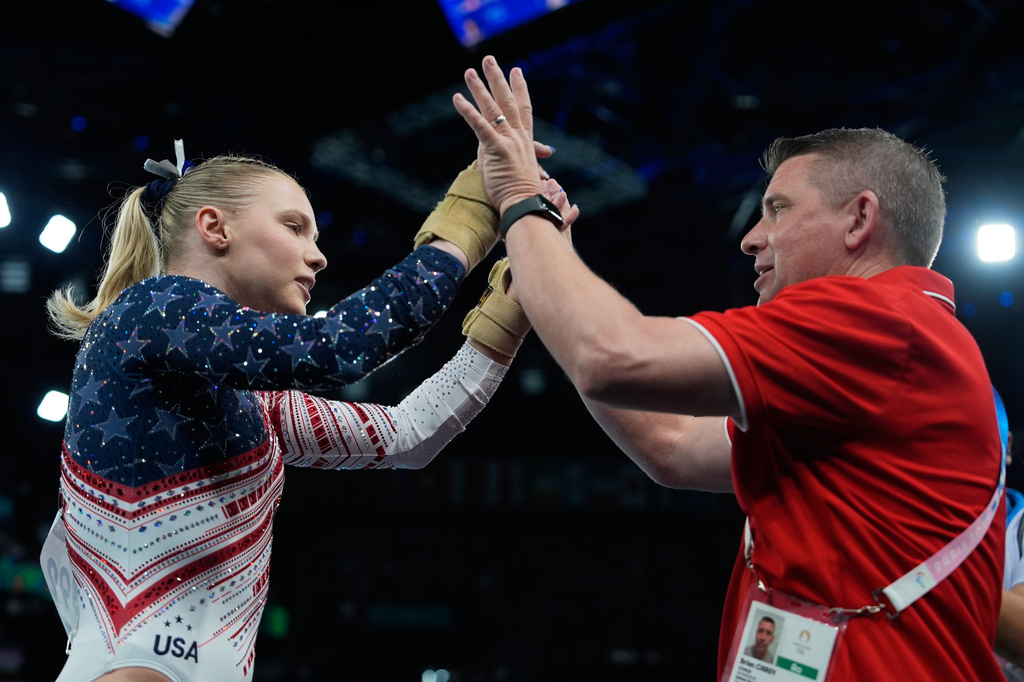 FILE - Jade Carey, of the United States, celebrates after performing on the vault during the women's artistic gymnastics team finals round at Bercy Arena at the 2024 Summer Olympics, July 30, 2024, in Paris. (AP Photo/Charlie Riedel, File)