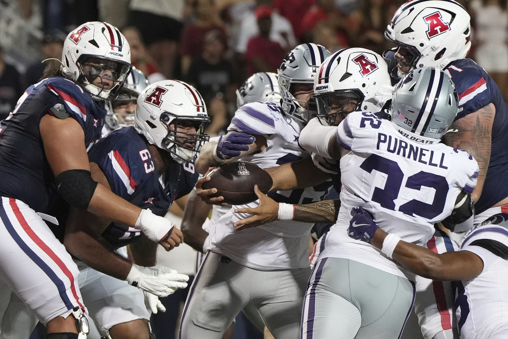 Arizona quarterback Noah Fifita (1) reaches over the line for a touch down against Kansas State in the first half during an NCAA college football game, Friday, Sept 12, 2025, in Tucson, Ariz. (AP Photo/Rick Scuteri)