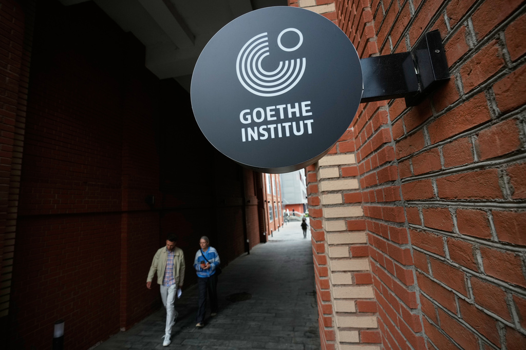 People walk past a street sign of the Goethe-Institut, Germany's cultural center in Moscow, Thursday, Sept. 3, 2026. (AP Photo/Pavel Bednyakov)