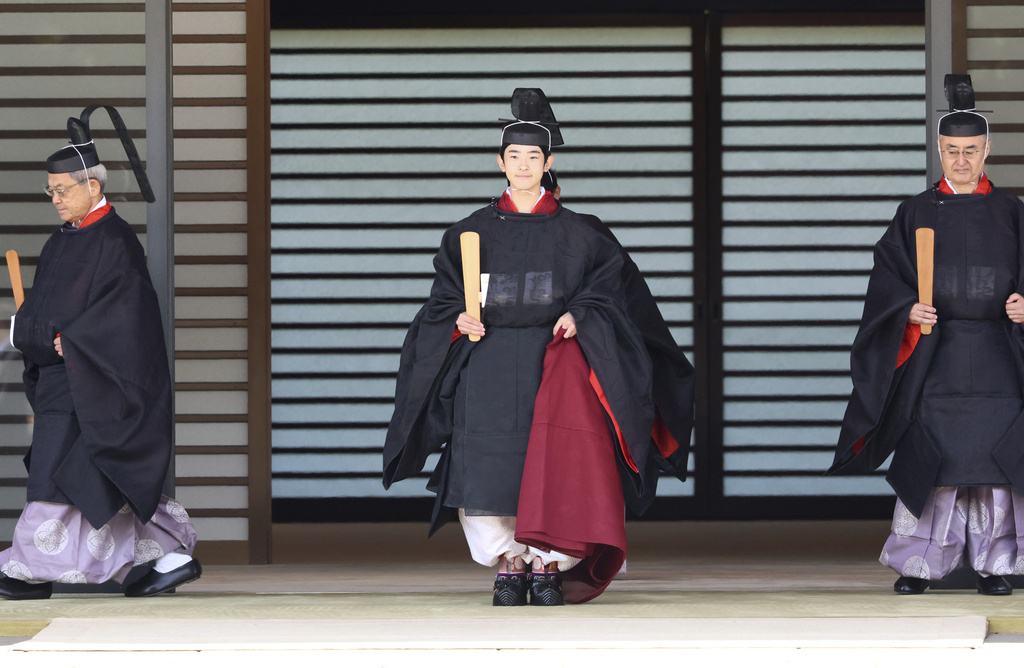 Japanese Prince Hisahito, son of Crown Prince Akishino, wearing ancient ceremonial costume, leaves for a ceremony by a carriage at the Imperial Palace in Tokyo Saturday, Sept. 6, 2025 as he celebrated his 19th birthday and attended the coming-of-age ceremony at the palace. (Yoshikazu Tsuno/Pool Photo via AP)