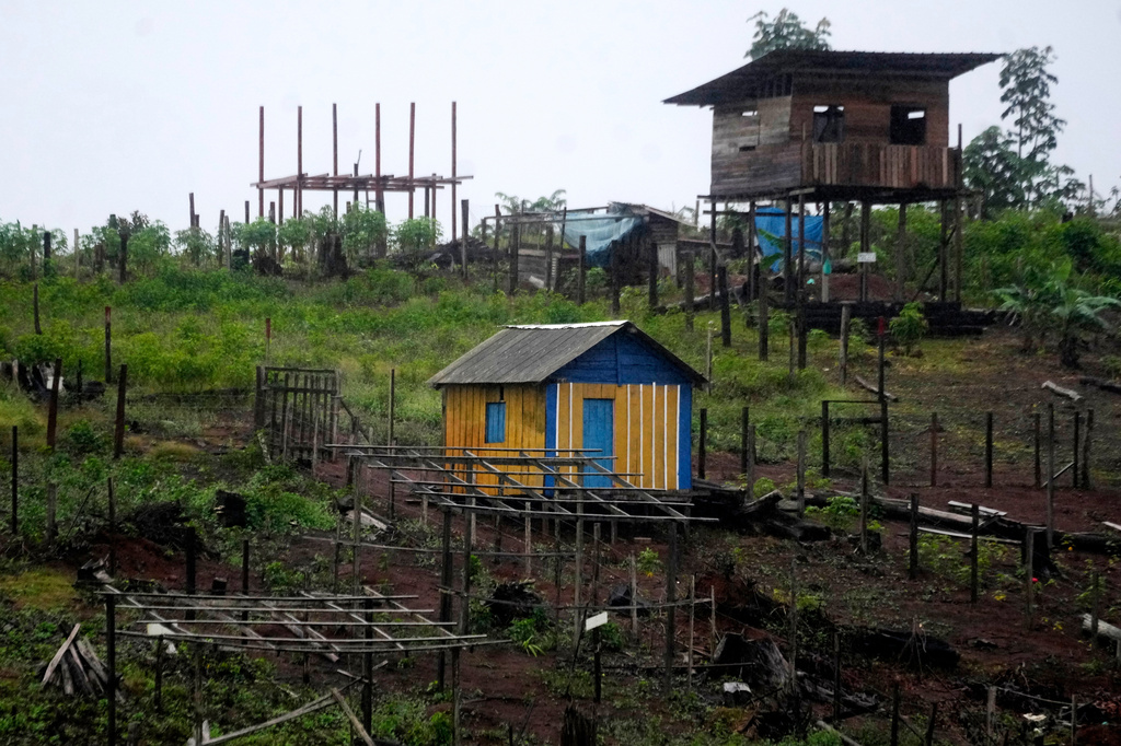 Construction is visible in an area known as Nova Conquista or New Conquest where families are building houses near the center of Oiapoque, Amapa state, Brazil, Wednesday, March 11, 2026. (AP Photo/Eraldo Peres)