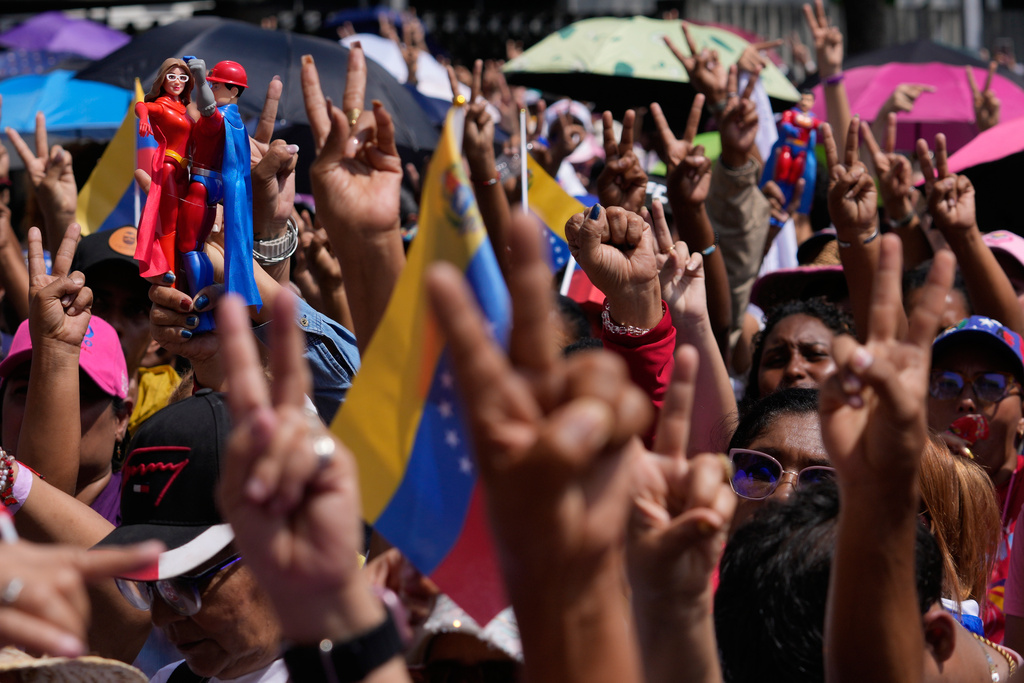 Government supporters gather for a women's march to demand the return of Venezuelan President Nicolas Maduro in Caracas, Venezuela, Tuesday, Jan. 6, 2026, three days after U.S. forces captured him and his wife. (AP Photo/Matias Delacroix)