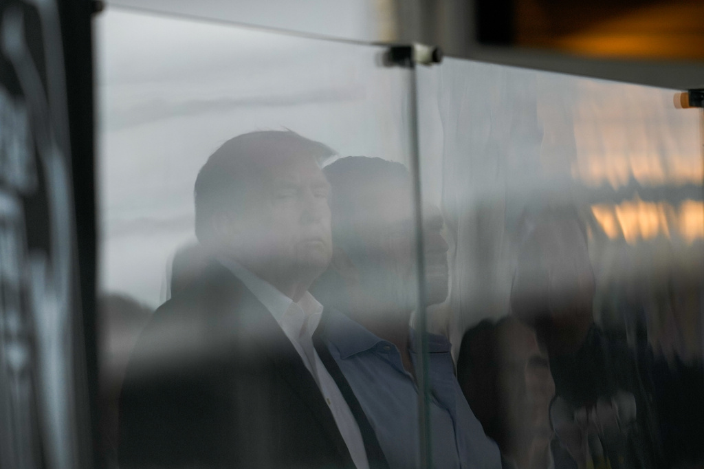 President Donald Trump watches play on the 18th hole during the final round of the Cadillac Championship PGA golf tournament Sunday, May 3, 2026, in Doral, Fla. (AP Photo/David J. Phillip)