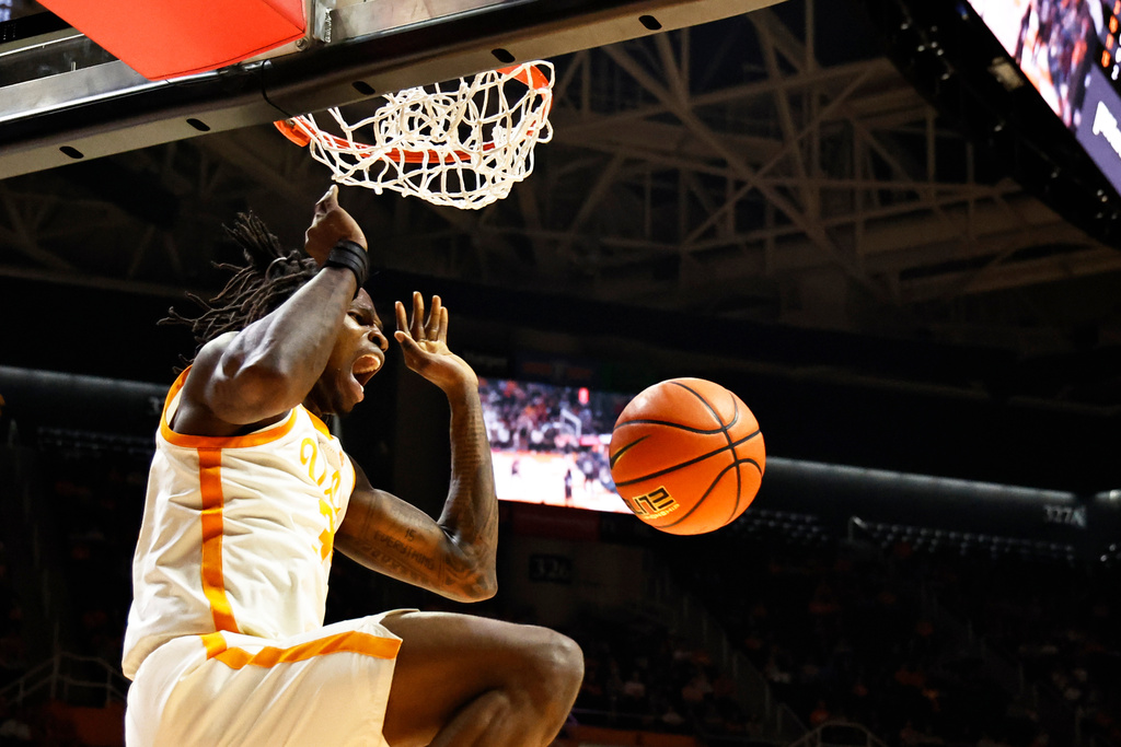 Tennessee center Felix Okpara (34) reacts to dunking the ball during the first half of an NCAA college basketball game against Louisville, Tuesday, Dec. 16, 2025, in Knoxville, Tenn. (AP Photo/Wade Payne)